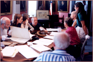 DeWolf descendants looking at family records from the slave trade at the Bristol Historical and Preservation Society, Bristol, Rhode Island.